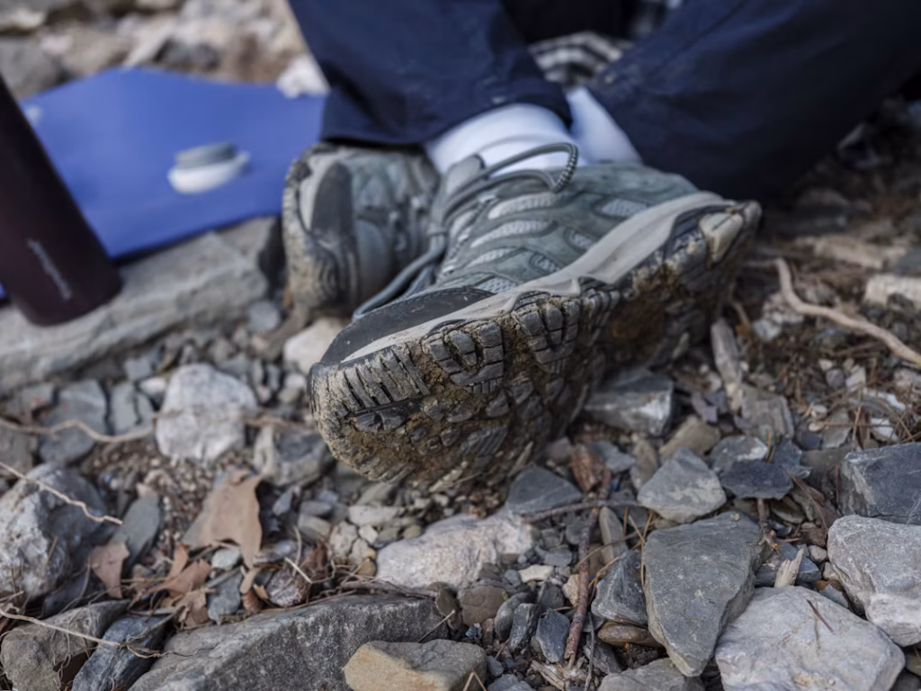 Muddy Trekking Boots on Rocky Trail