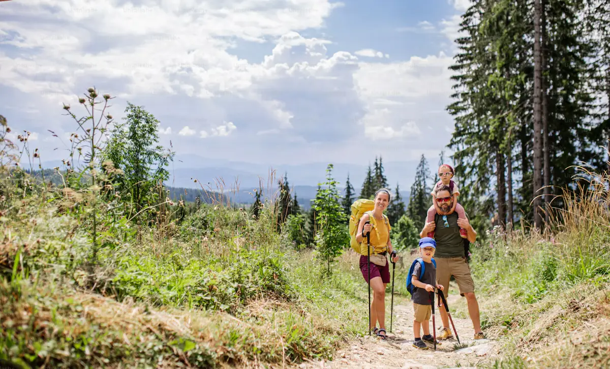Family with Children Hiking Outdoors in Nature